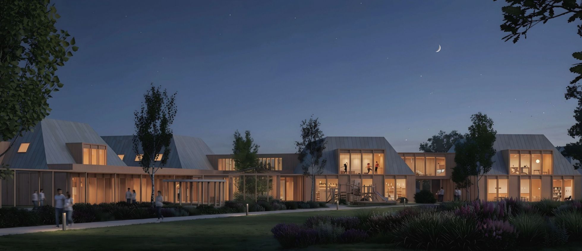 The same view at night, with warm light inside the rooms.